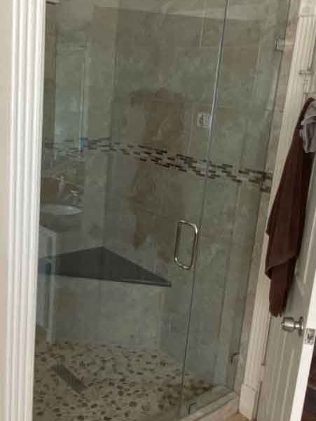 A simple shower area with pattern wall
