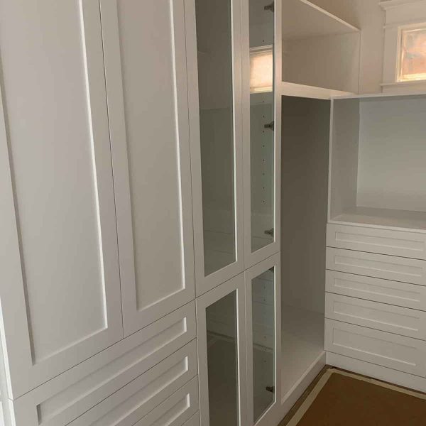 A huge white shelves for wardrobe area