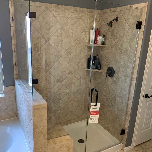 A beautiful cornered shower area with glass door