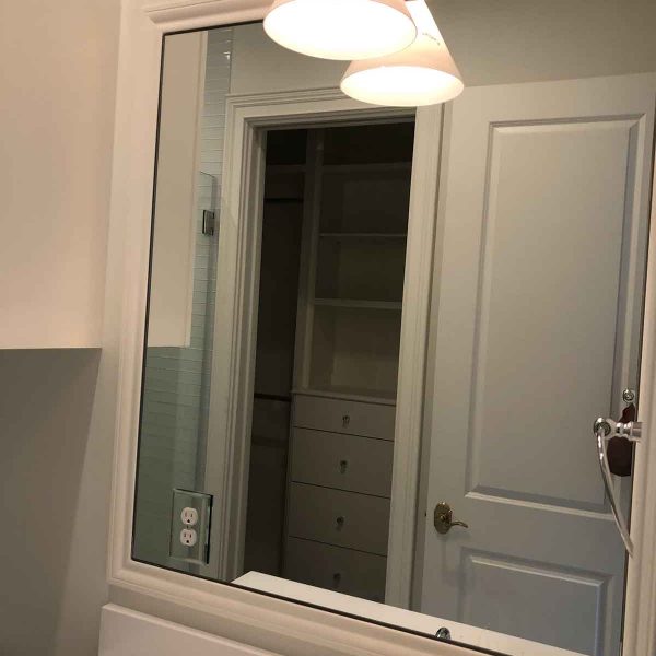 A wide mirror for simple bathroom