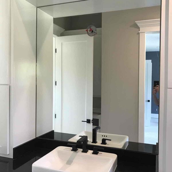 A beautiful mirror for simple bathroom