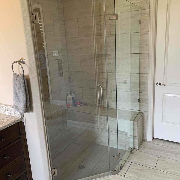 A shower area with glass door